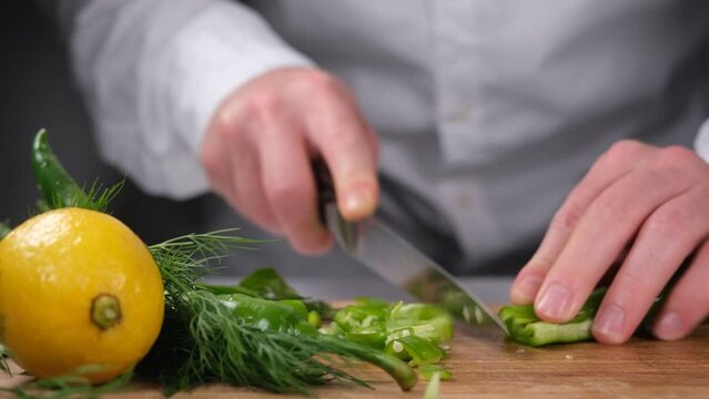 chopping chili peppers