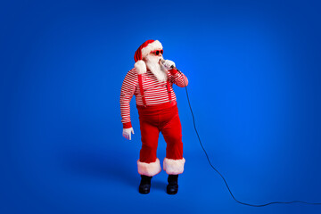 Full length body size view of his he handsome bearded fat overweight talented Santa vocalist star...