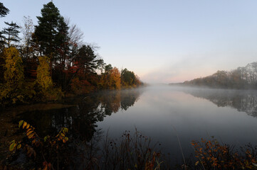 Naklejka na ściany i meble the sun rises on a lake in the fall 