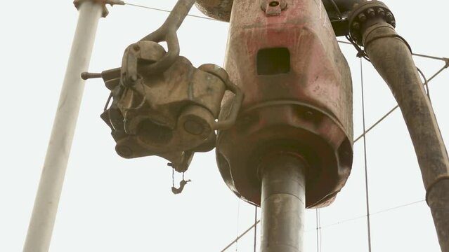 Drill pipe and rig tong on the rig floor while making up for drilling. Drawworks, lowering and lifting of drill pipes, lowering of casing pipes