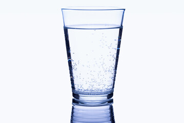 Glass of drink water with gas on white background.