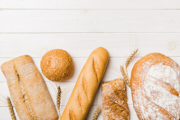 Homemade natural breads. Different kinds of fresh bread as background, top view with copy space