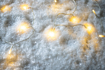 christmas string lights in snow