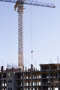 vertical stock image of construction site with crane