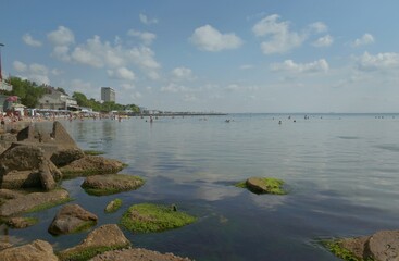 A walk at dawn along the embankment of the city of Feodosia, Russia, seascape of a summer morning, the concept of travel and recreation.