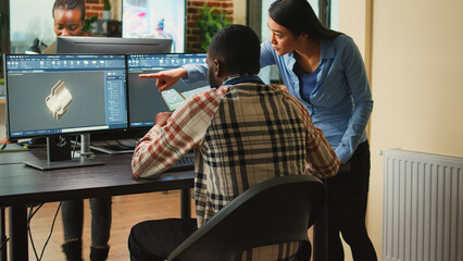 Professional industry experts working on engine development with 3d cad software, industrial...