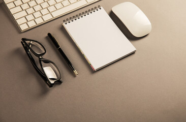 Keyboard, glasses and notepad