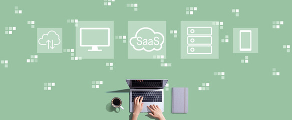 SaaS - software as a service concept with person working with a laptop