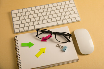 Keyboard, glasses and notepad