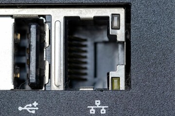 Closeup shot of firewire and small inputs on a digital computer workstation