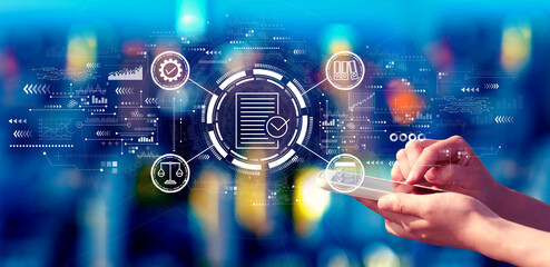 Compliance theme with person using a smartphone in a city at night