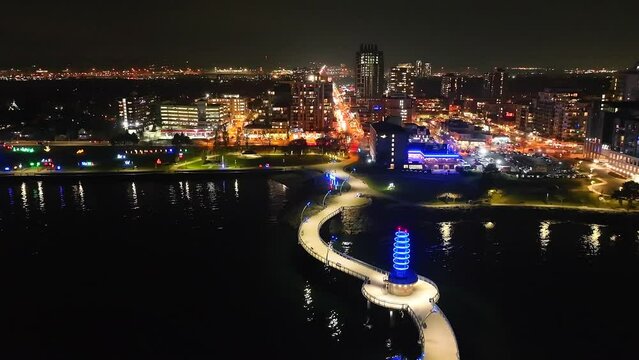 Drone shot of downtown Burlington with festive lights and night cityscape, Ontario, Canada