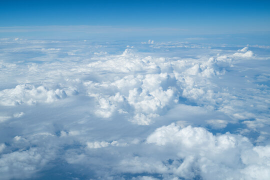 Clouds from above with blue background.