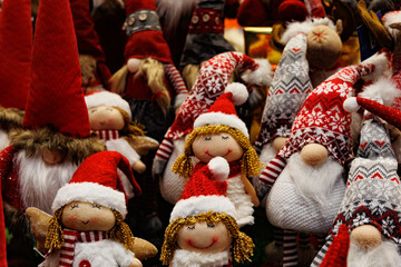  plush christmas elves in red hats background