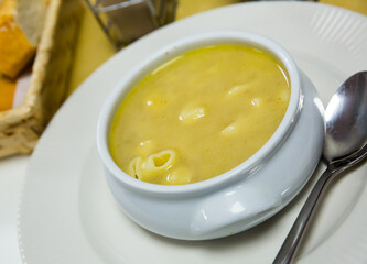Homemade nourishment pasta soup served in bowl