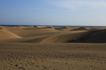 Fototapeta na wymiar The Maspalomas dunes are sand dunes located on the southern coast of the island of Gran Canaria in the Canary Islands