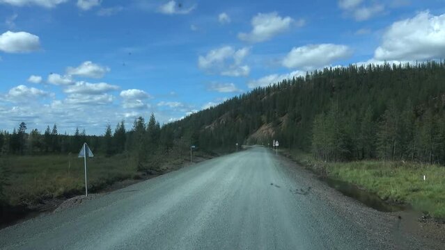 Famous "Road of Bones" - Kolyma ballast road from Magadan to Yakutia through Kolyma Range and taiga forests. Road of Bones becaus built by perishing political prisoners during reign of Stalin