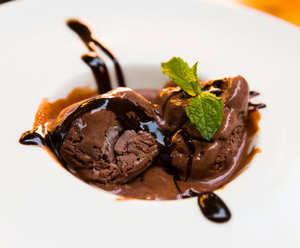 Image of homemade chocolate ice cream with chocolate cream and mint
