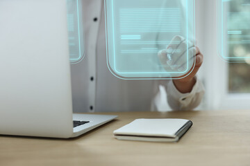 Concept of electronic signature. Woman working on laptop at table indoors, closeup