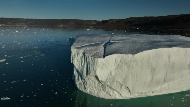 reflections over eqi glacier from aerial view