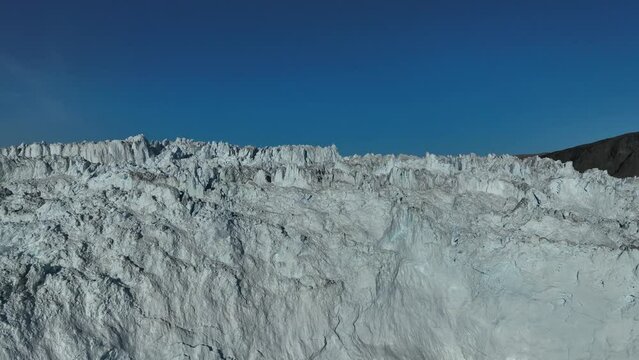 extreme cracks over eqi glacier from aerial view