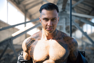 man with muscle hot body in leather . tattooed hot guy. 