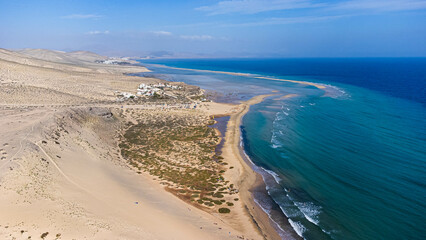 Fototapeta na wymiar Aerial view of the Sotavento beach in the south of Fuerteventura in the Canary Islands, Spain - Sand strip in the Atlantic Ocean among a desertic barren landscape