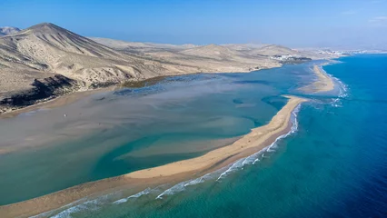 Wall murals Sotavento Beach, Fuerteventura, Canary Islands Aerial view of the Sotavento beach in the south of Fuerteventura in the Canary Islands, Spain - Sand strip in the Atlantic Ocean among a desertic barren landscape