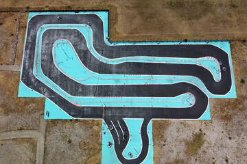 Aerial drone view of carting race track. Karting racetrack view above. Speedway kart field.