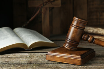 Judge gavel on old wooden table, closeup. Space for text