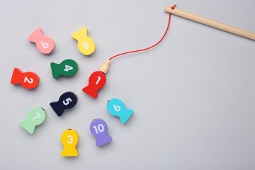 Educational game Fishing for Numbers on light grey background, flat lay. Space for text