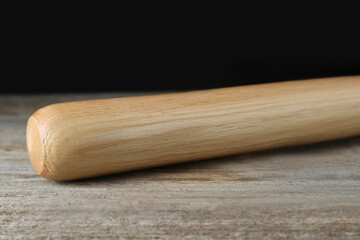 Baseball bat on wooden table. Sports equipment