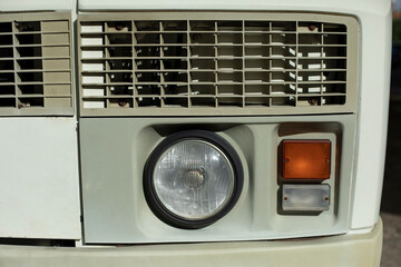 Fototapeta na wymiar Bus Headlamp. Transport details. Retro car.