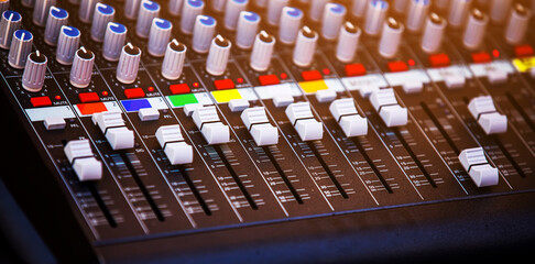 Concert sound mixer panel with volume regulators. Professional audio and light equipment for sound...