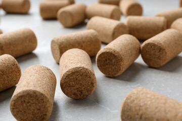 Wine bottle corks on light grey marble table, closeup