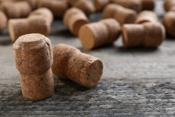 Sparkling wine bottle corks on wooden table, closeup