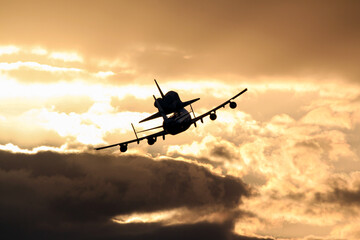 A space shuttle carrier aircraft taking off early morning. Digitally enhanced. Elements of this image furnished by NASA.