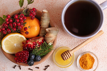 Flat lay composition with cup of delicious immunity boosting tea and ingredients on color textured background