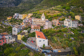 Fototapeta na wymiar Aerial view of Corniglia and coastline of Cinque Terre,Italy.UNESCO Heritage Site.Picturesque colorful village on rock above sea.Italian Riviera landscape.Steep cliff.September 2022