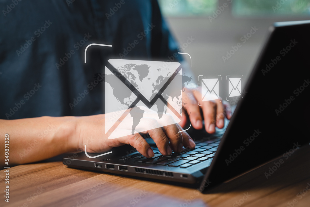 Aufkleber Man's hand using computer laptop and sending online message with email icon, email marketing concept, send email or newsletter, internet network working online.