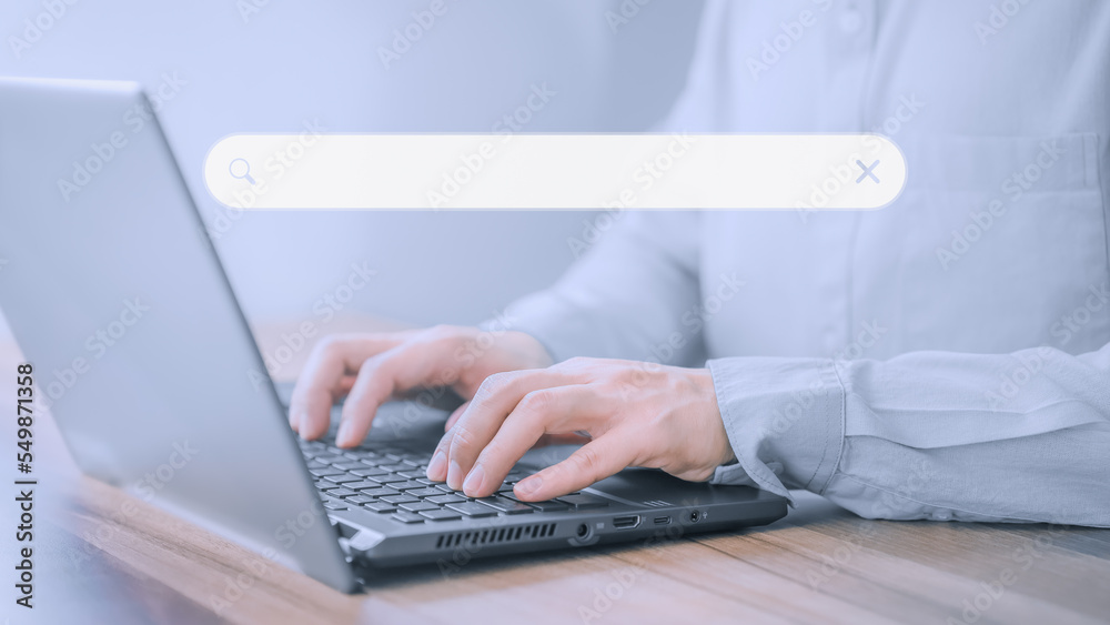 Poster Businessman's hand working with computer laptop on desk in home. Searching Browsing Internet Data Information with blank search bar. Search Engine Optimization SEO Networking Concept.