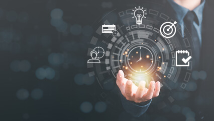 Businessman showing virtual icon in hand, time management concept,effective business planning,time management in the organization,Agreement and solution,