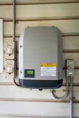 Solar power inverter mounted on side of a house, domestic system
