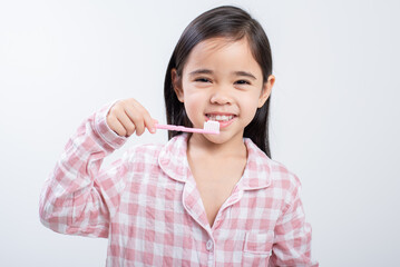 little girl Asia brushing teeth happily white background