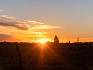 sunset in the town of russell kansas