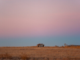 small shed in the sunrise over a field in Kansas