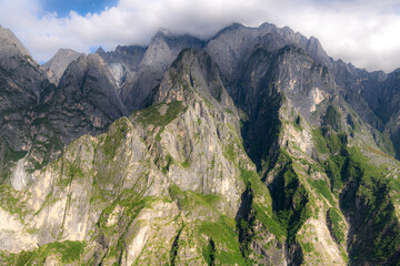 Fototapeta premium Panoramic top view of the Jade Dragon Snow Mountain is on the hiking trails of the Tiger Leaping Gorge, Lijiang Yunnan, China
