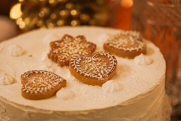 Gingerbread Christmas holidays cookies on a beautiful decoration setup. Photo with X-mas food desert cakes.