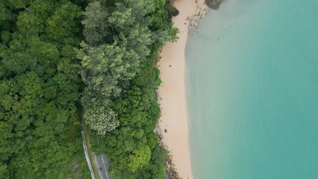Aerial top shot of Road near Pasir Tengkorak beach, Langkawi, Malaysia