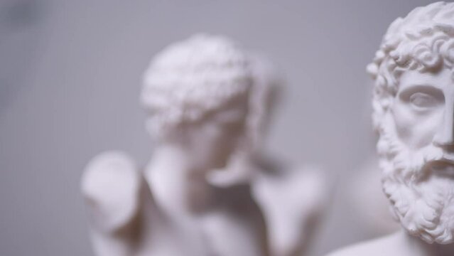 Statue of Greek God Zeus with others out of focus - Left to Right